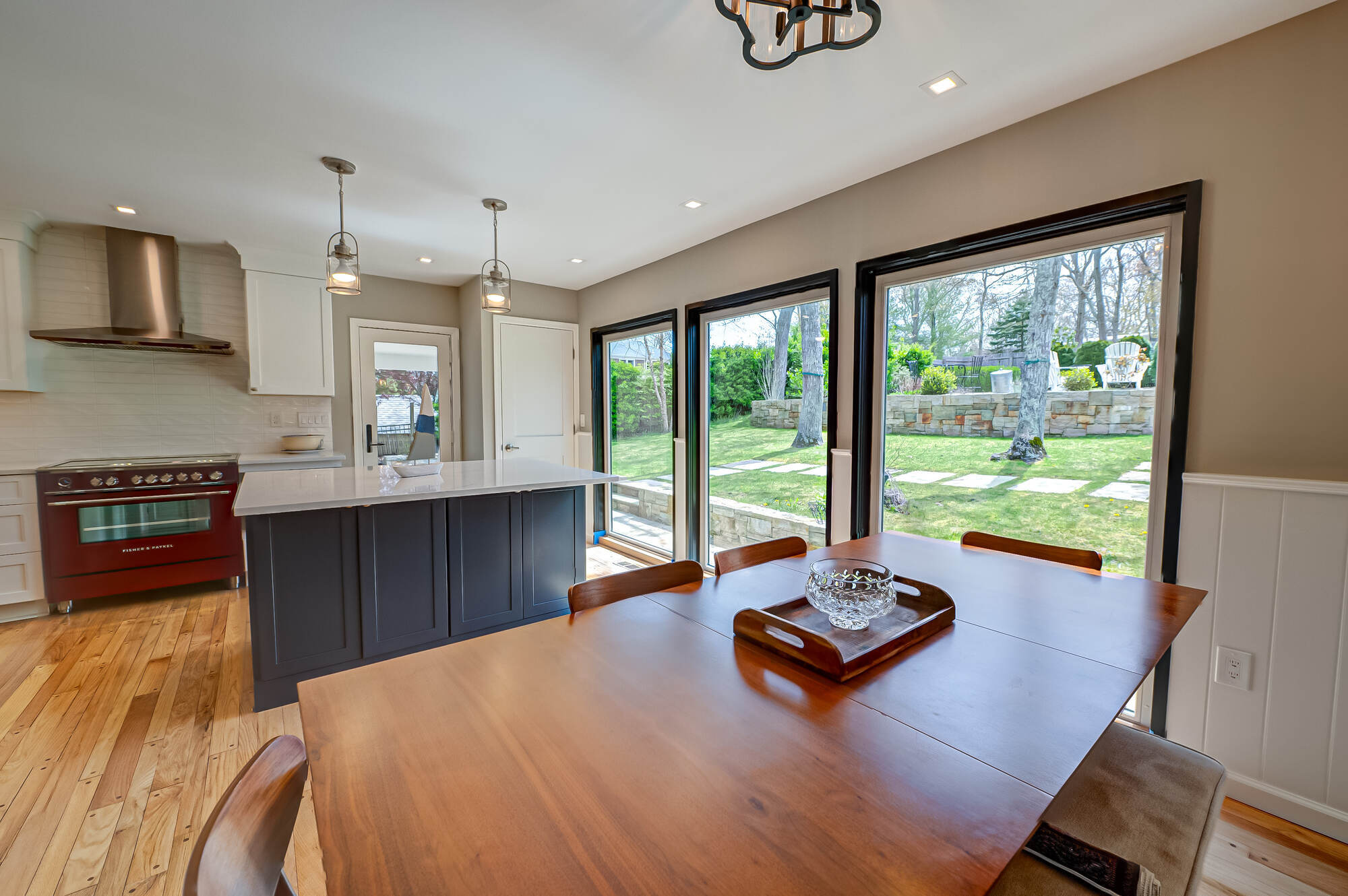 Open dining area and kitchen remodel with outdoor connection in Three Villages, NY by Long Island Creative Contracting, Inc Open dining area and kitchen remodel with outdoor connection in Three Villages, NY by Long Island Creative Contracting, Inc