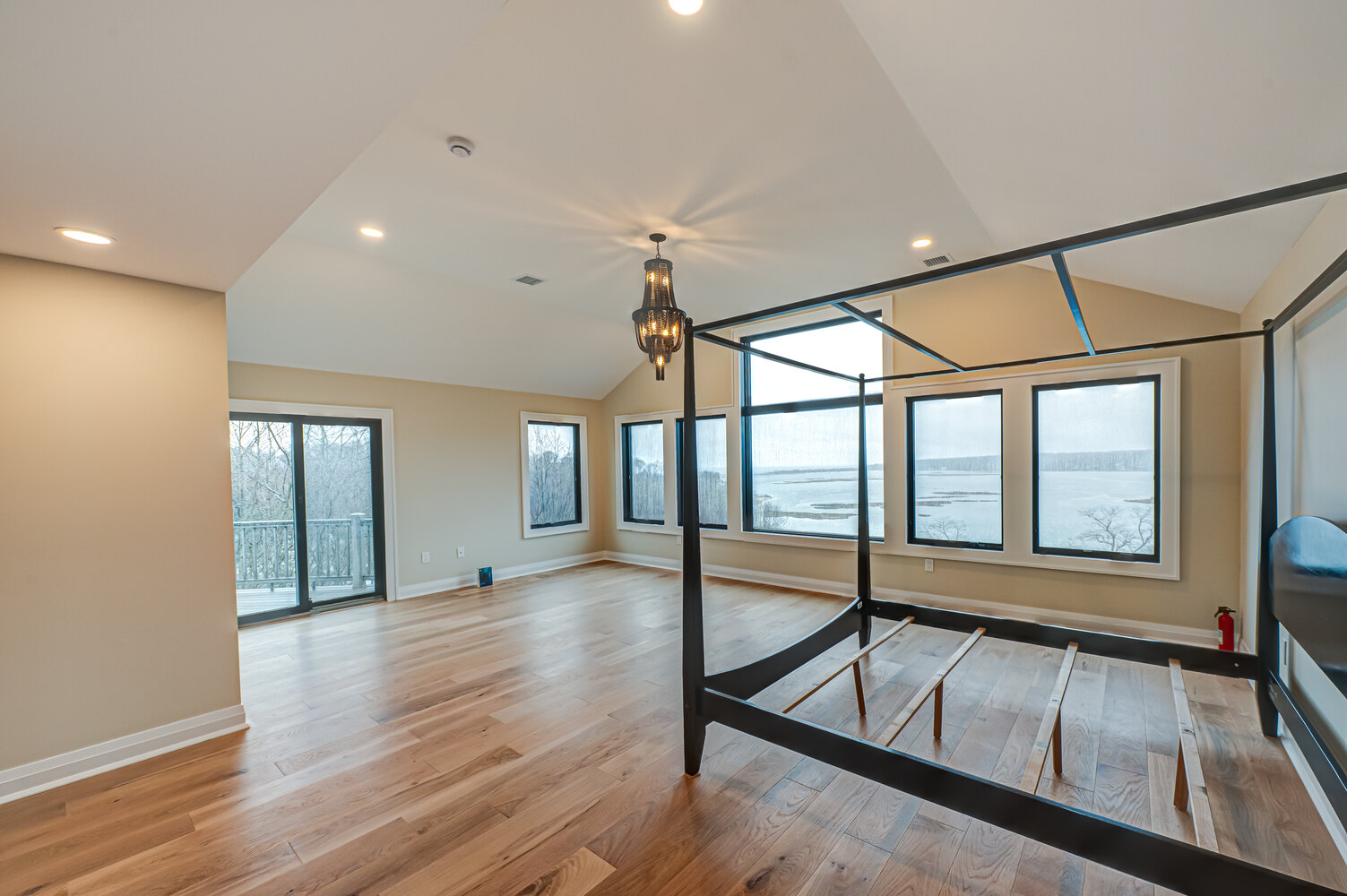 Light-filled master suite with lake views in a Long Island Creative Contracting home in Miller Place, NY