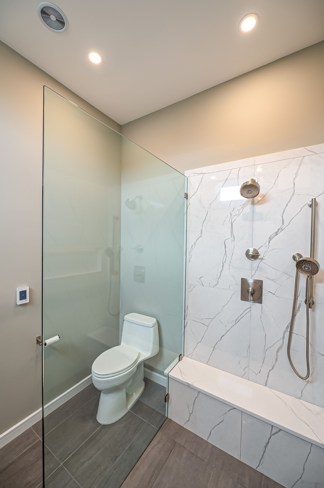 Full view of custom shower and toilet in bathroom remodel by Long Island Creative Contracting in Port Jefferson, NY