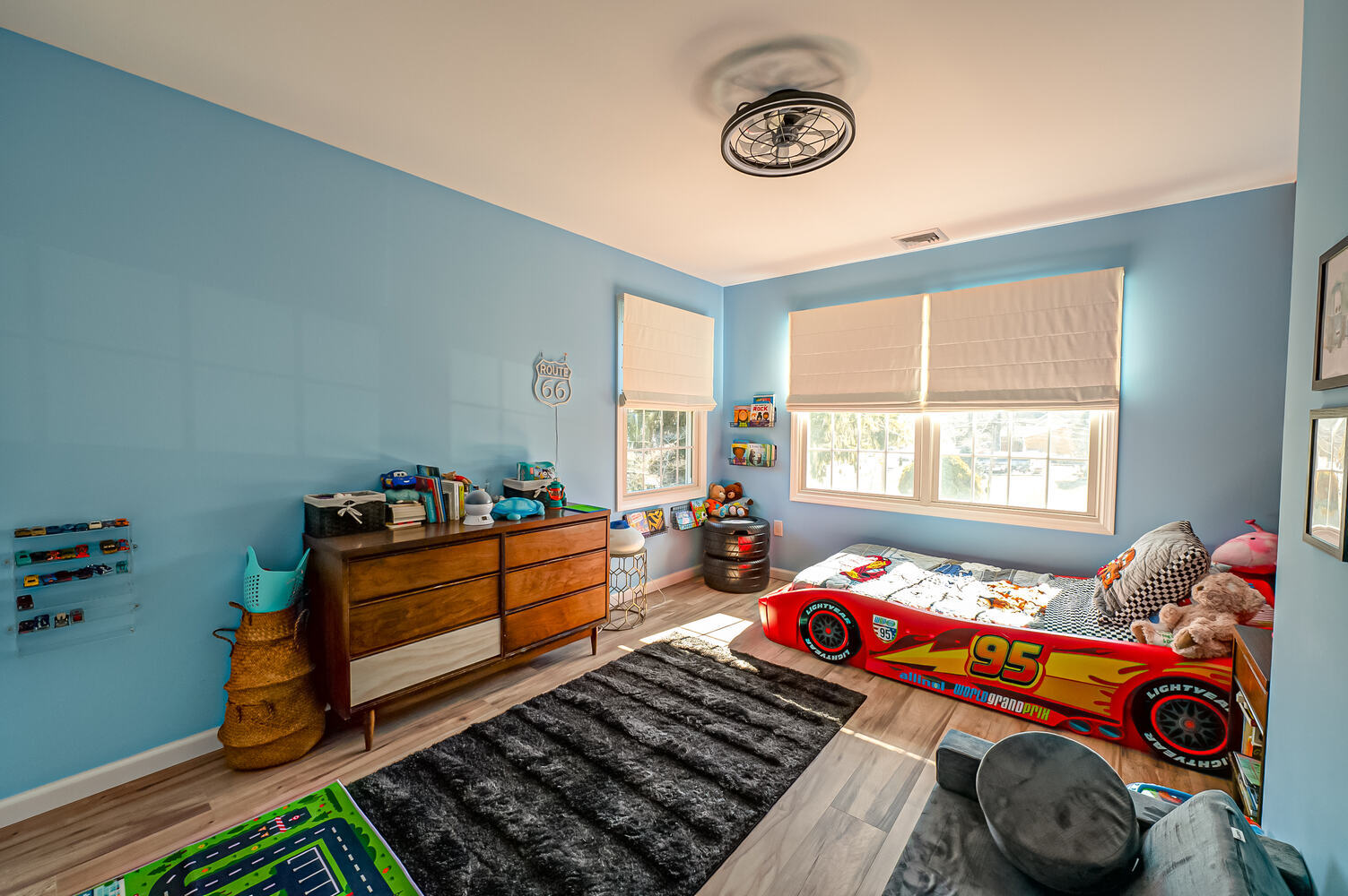 Custom kids bedroom with blue walls and Lightning McQueen bed in a Long Island Creative Contracting, Inc. home