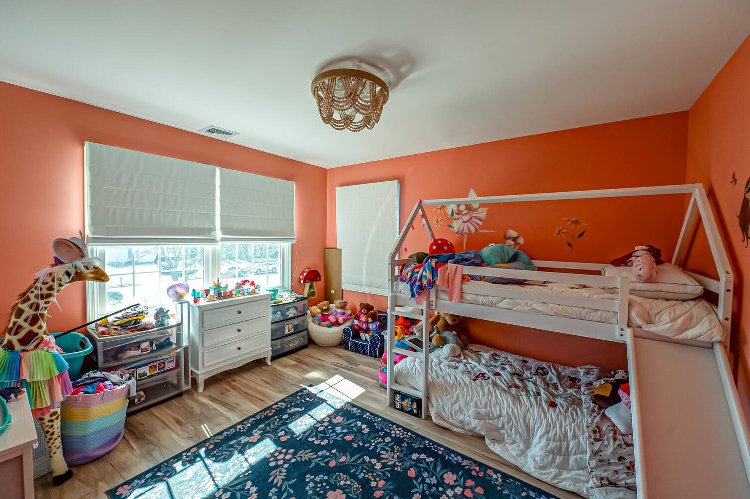 Playful children’s room with bunk beds and toys in Miller Place, NY custom home by Long Island Creative Contracting, Inc