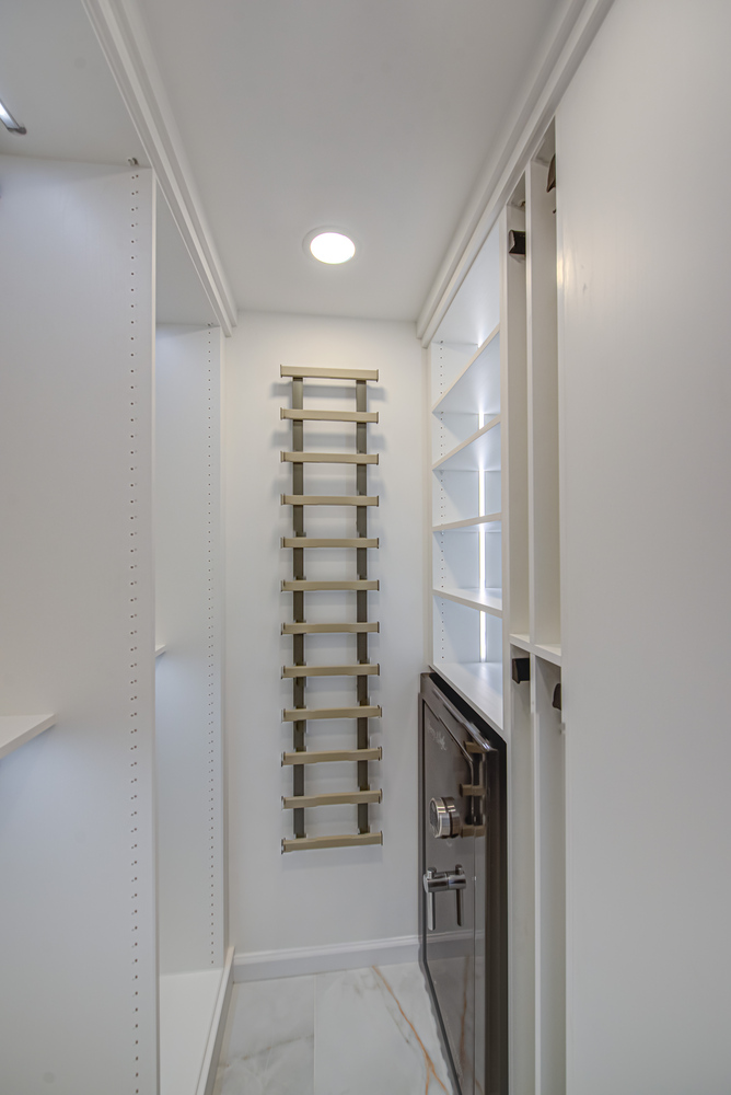 Closet remodel featuring a built-in vault and shelving by Long Island Creative Contracting, Inc. in Huntington, NY
