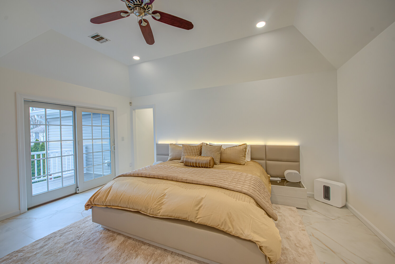 Spacious master bedroom with direct patio access in Port Jefferson Station, NY by Long Island Creative Contracting, Inc