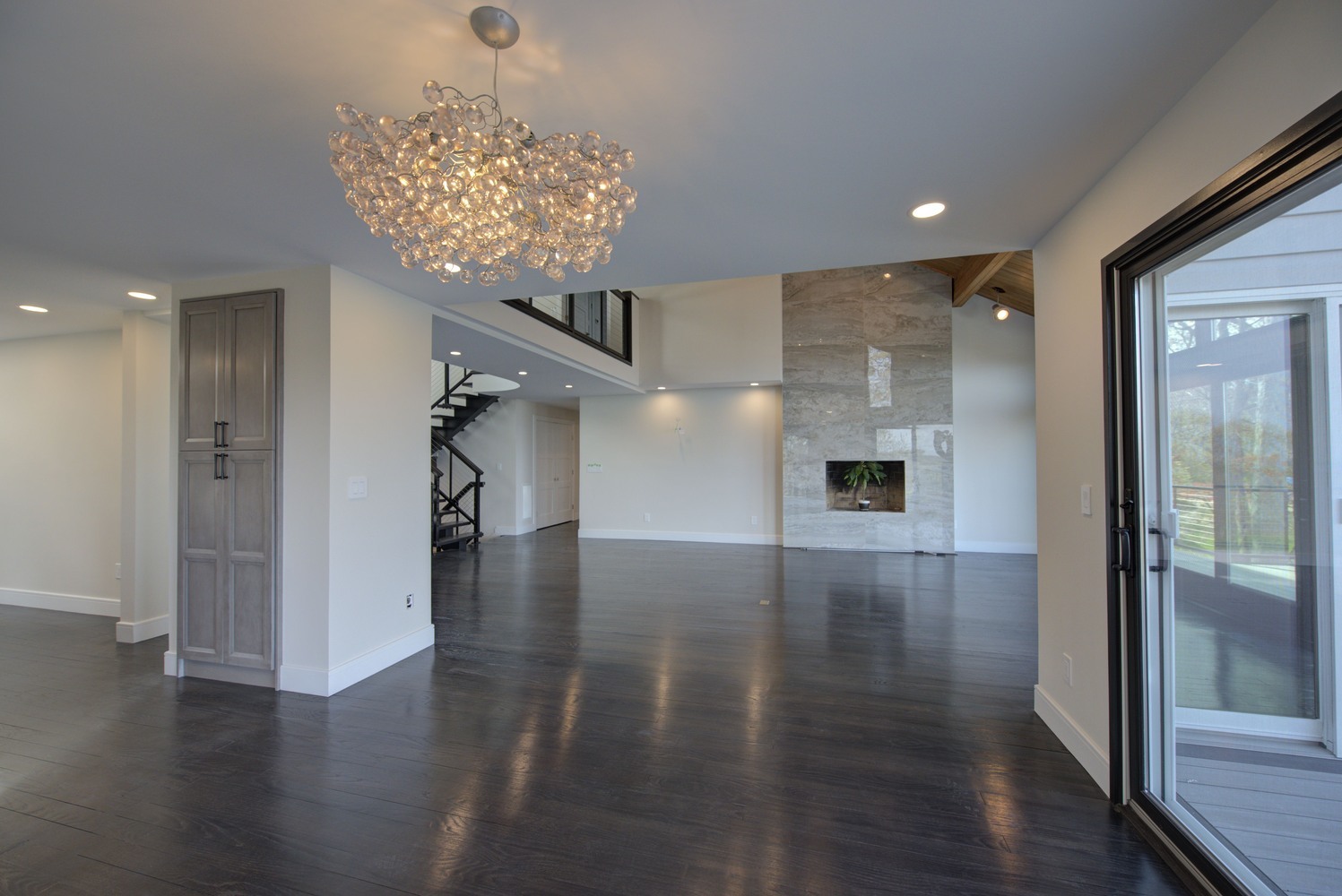 Contemporary living and dining room with luxury finishes by Long Island Creative Contracting, Inc. in Setauket, NY