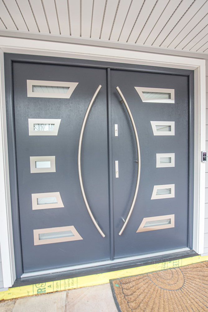Eye-catching custom double door entrance in a Northport NY new home by Long Island Creative Contracting, Inc