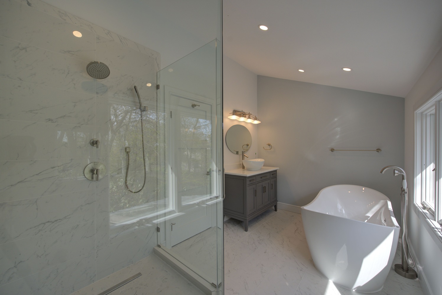 Luxurious bathroom remodel with freestanding tub and marble shower in Miller Place, NY by Long Island Creative Contracting, Inc