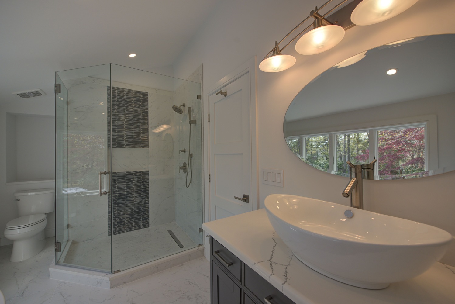 Modern master bathroom remodel with glass shower and luxury finishes in Port Jefferson, NY