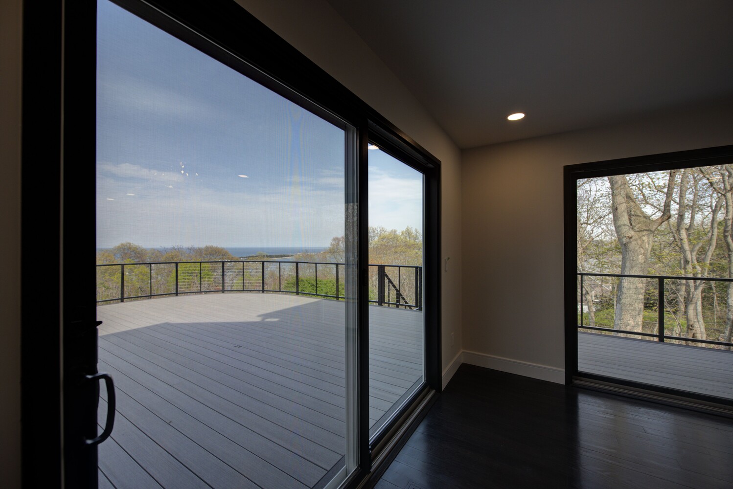 Panoramic deck with scenic water views in a custom home build by Long Island Creative Contracting, Inc. in Old Field, NY