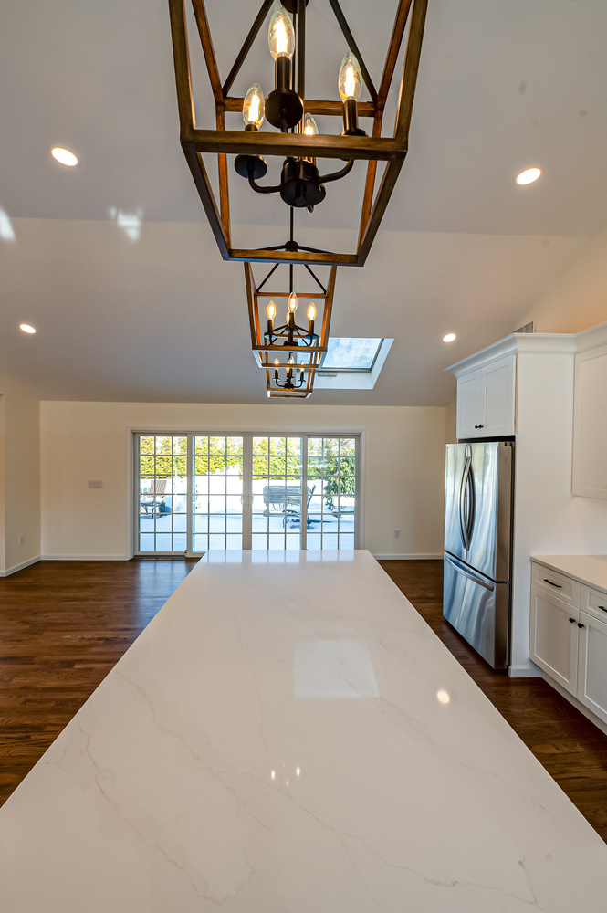 Functional kitchen design with stainless steel appliances by Long Island Creative Contracting, Inc. in Suffolk County, NY