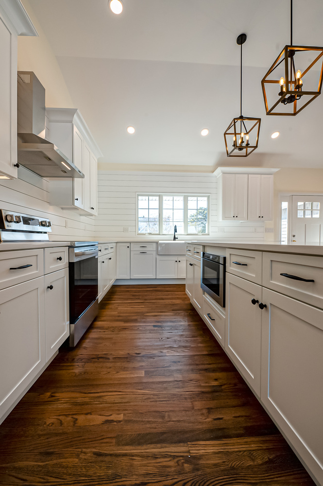 Kitchen view featuring double oven and large island in a Three Villages, NY home by Long Island Creative Contracting, Inc