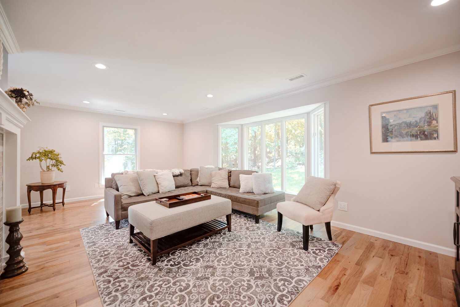 Custom-designed lounge with natural light and modern finishes in a Suffolk County home