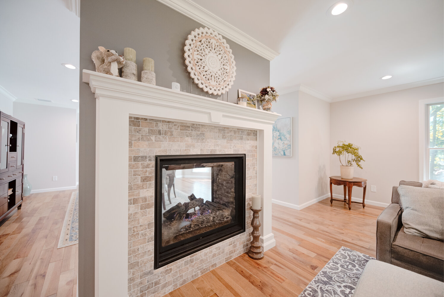 Fireplace focal point with decorative molding and mantel in a Stony Brook, NY custom home build