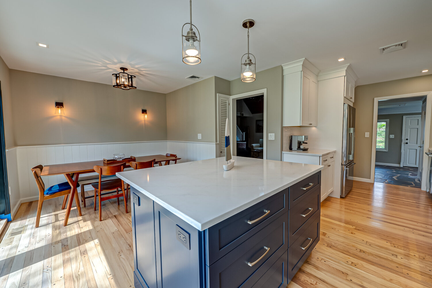 Custom kitchen and dining remodel with island in Port Jefferson Station, NY by Long Island Creative Contracting, Inc