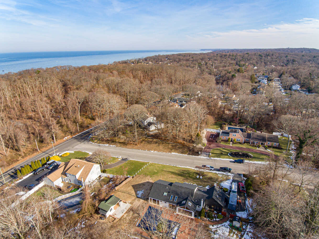 Wide landscape view showing Miller Place neighborhood and modern home built by Long Island Creative Contracting