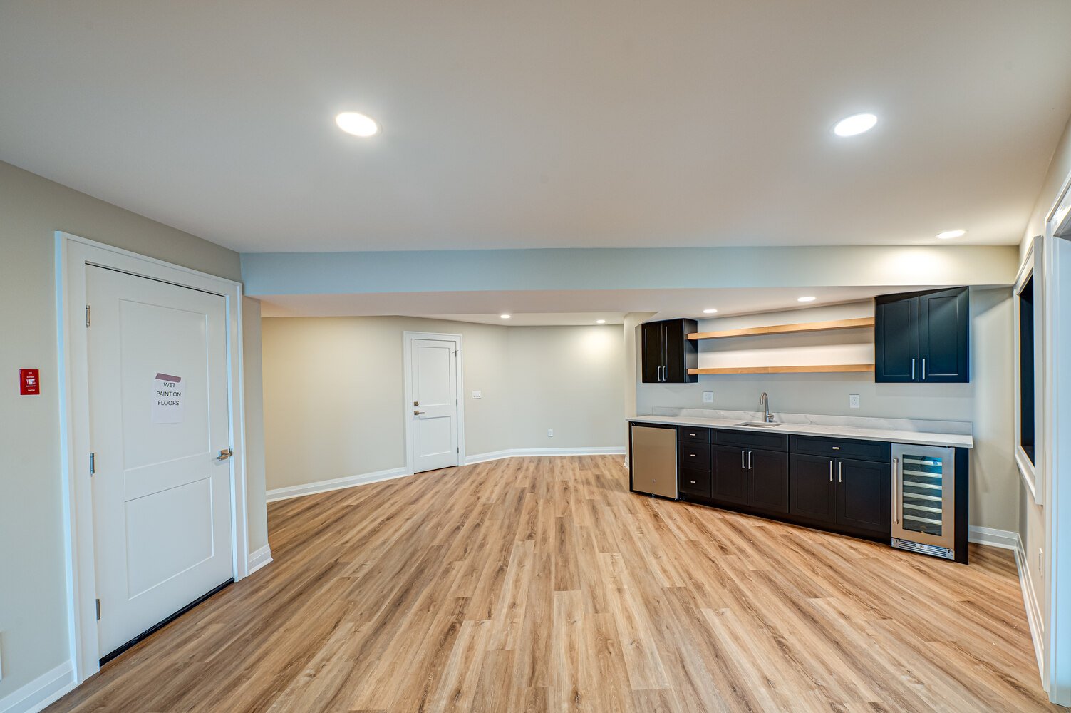 Basement bar with modern finishes in a Miller Place custom home by Long Island Creative Contracting