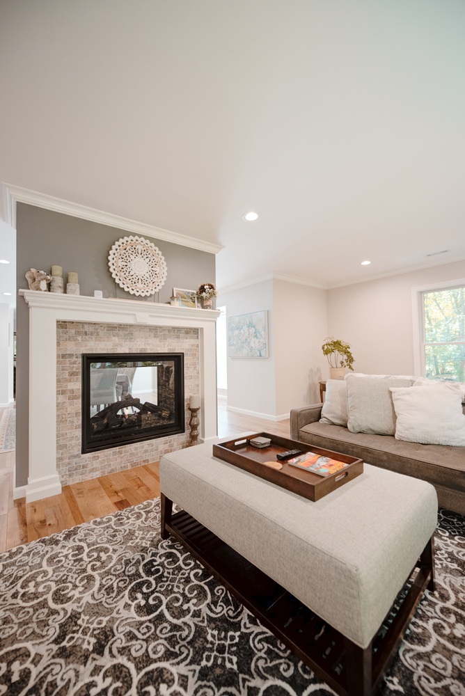 Comfortable living space with neutral tones in Miller Place, NY custom home by Long Island Creative Contracting, Inc
