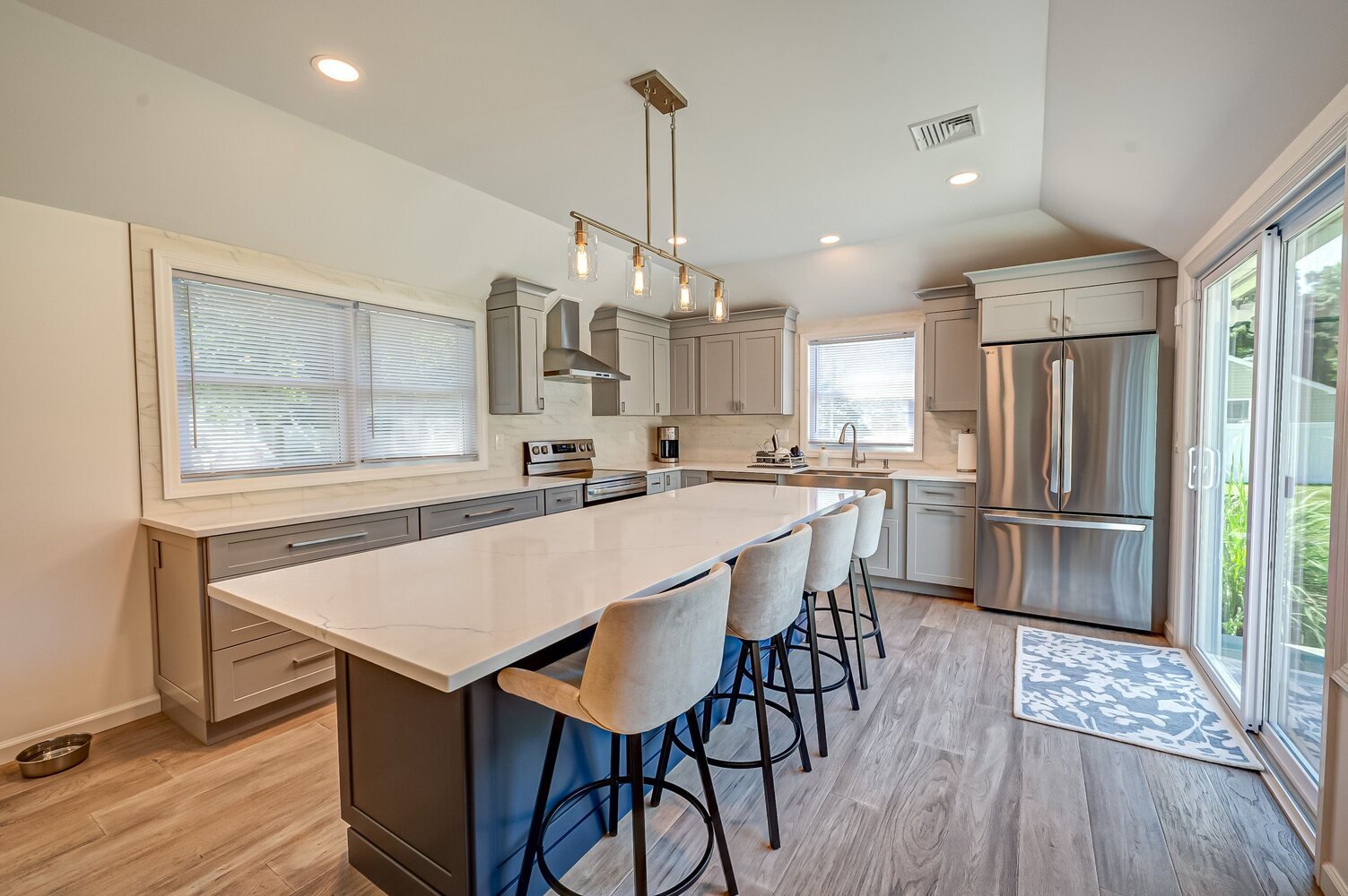 Contemporary kitchen with soft-close cabinetry and modern lighting in Port Jefferson, NY by Long Island Creative Contracting